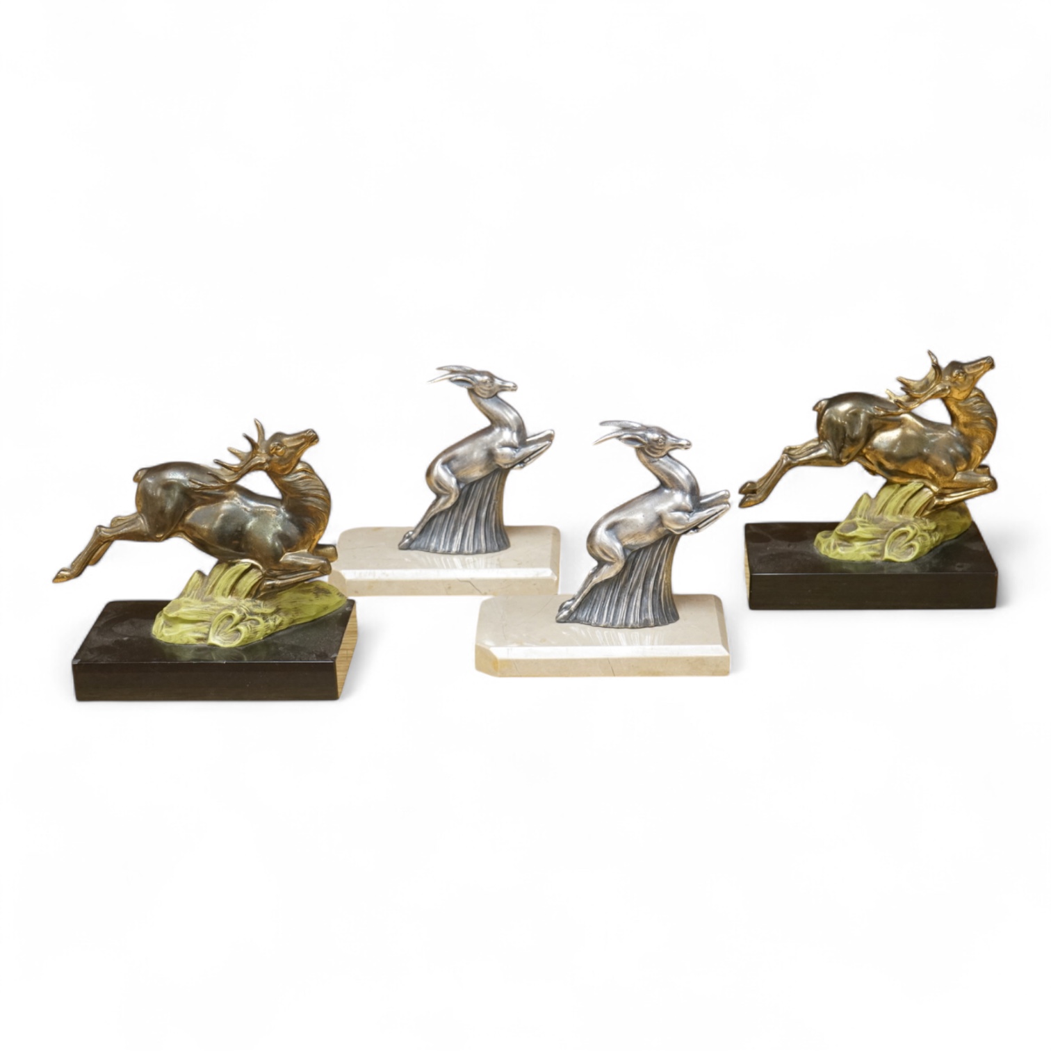 Two pairs of Art Deco bookends in the form of leaping animals, largest 14cm wide